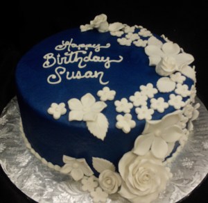Dark blue cake with white flowers