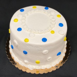 Round frosted cake with polka dots