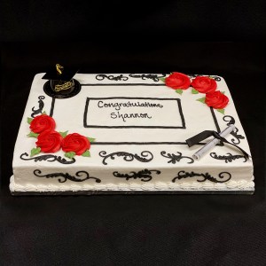 Graduation cake with black scrollwork and red roses